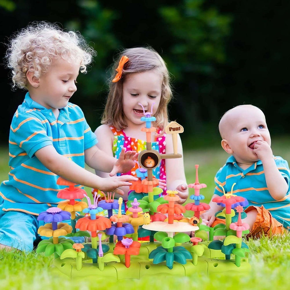 Cute Stone Flower Building Toy Set by CUTE STONE; colorful plastic flower pieces for outdoor building play