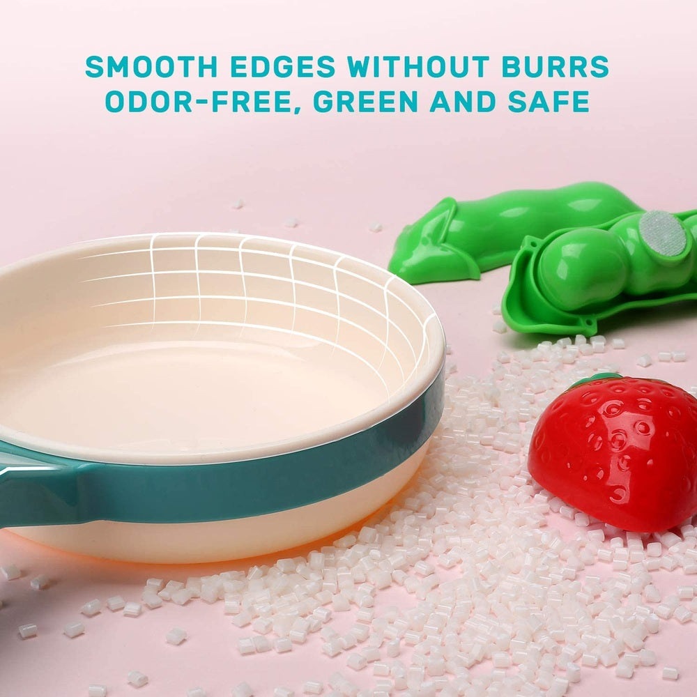 Cute Stone microwave playset by CUTE STONE; teal exterior, beige interior, strawberry accessory.