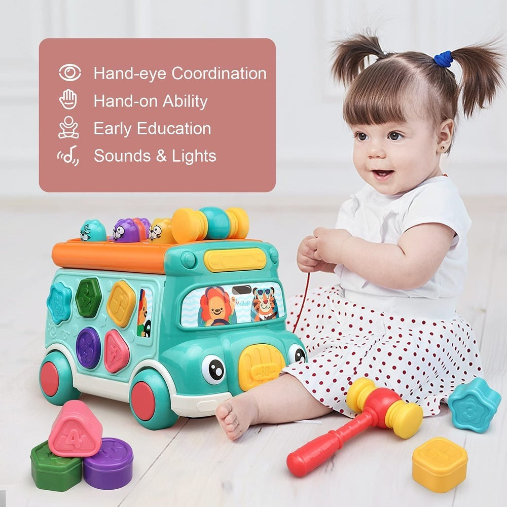 Cute Stone multifunctional bus toy featuring turquoise body, yellow accents and colorful shape blocks; toddler playing.