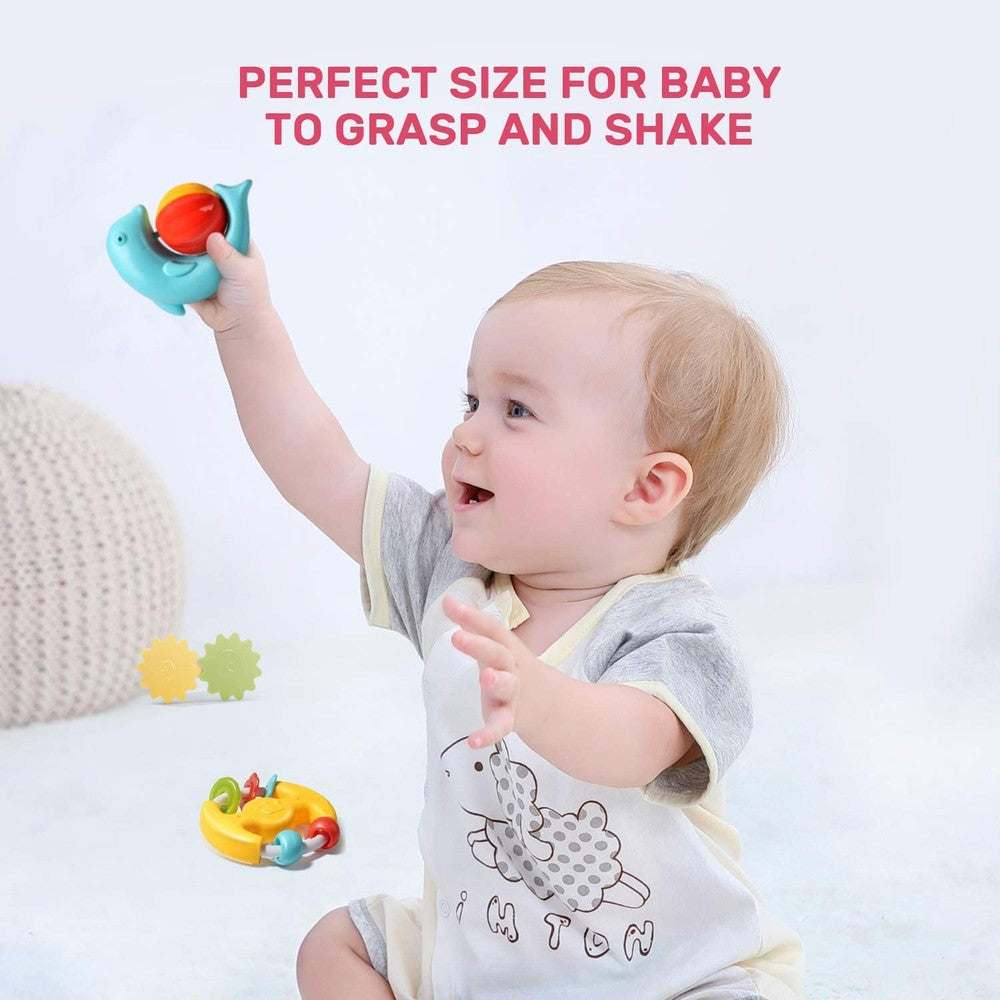 Cute Stone Rattle & Teether Set by CUTE STONE; baby plays with blue whale rattle (red ball) and yellow/green teether pieces