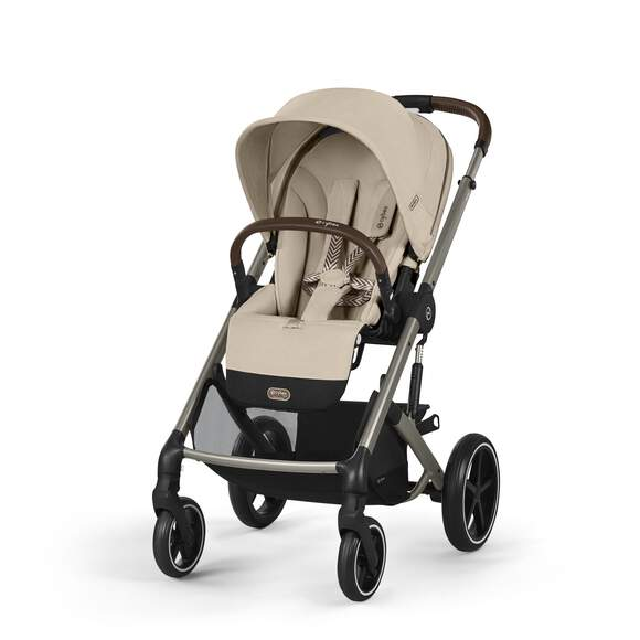 Beige Cybex Balios S Lux stroller with tan canopy, padded seat, brown leatherette handle, gray frame, black accents.