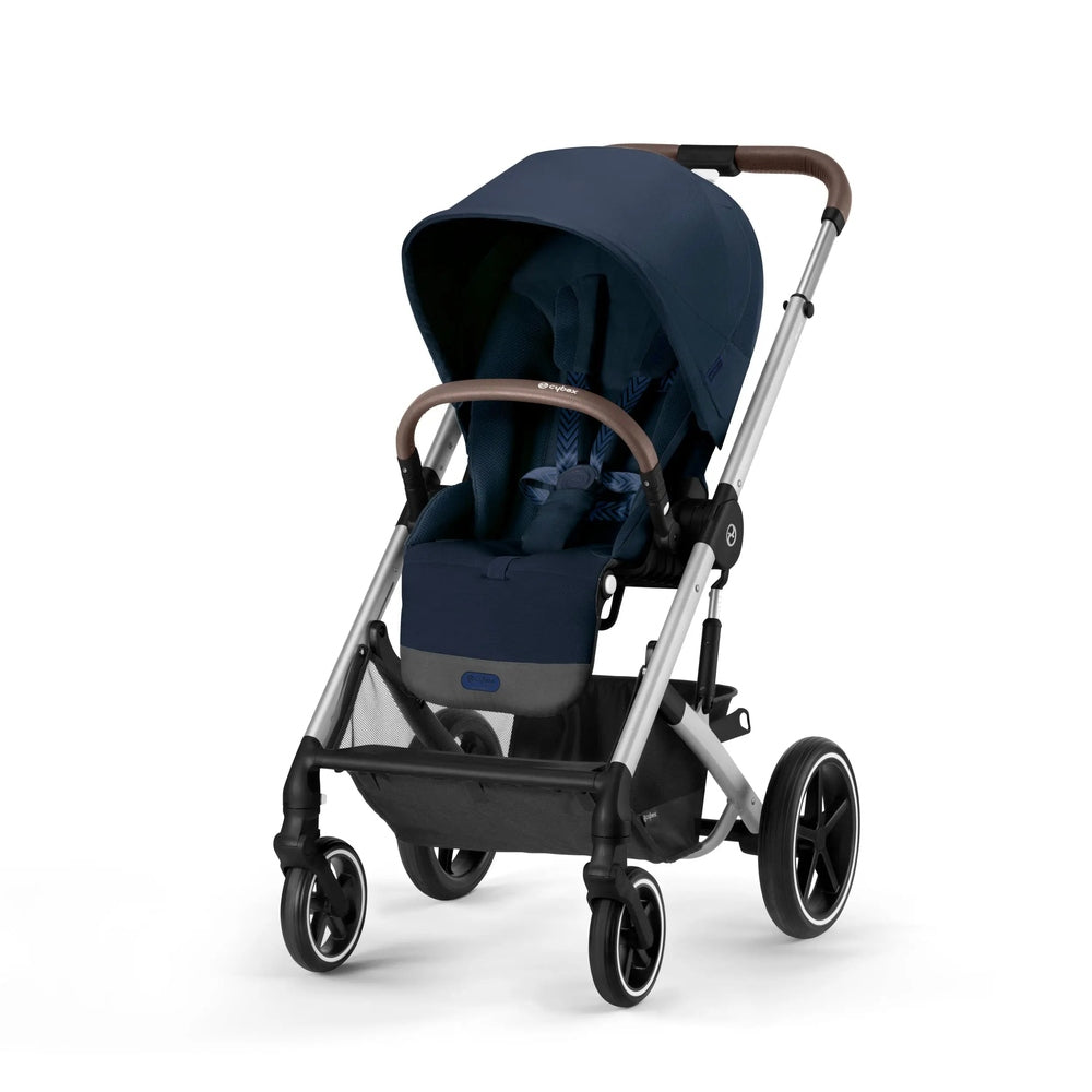 Cybex Balios S Lux Stroller in navy blue with brown leatherette handle and silver frame; canopy up for a smooth stroll.
