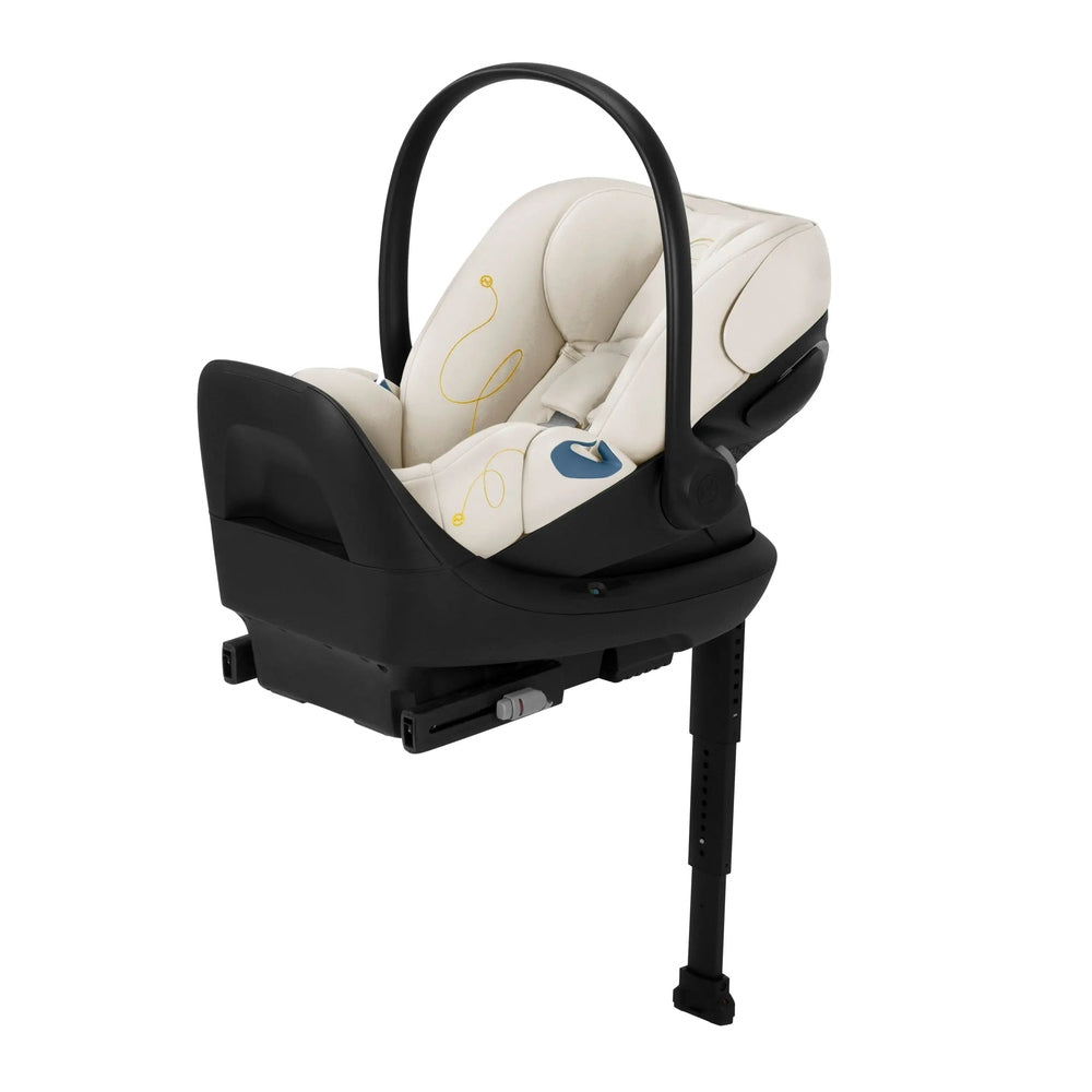 Cybex Cloud G Lux reclining infant car seat in cream upholstery with black base and curved carry handle.