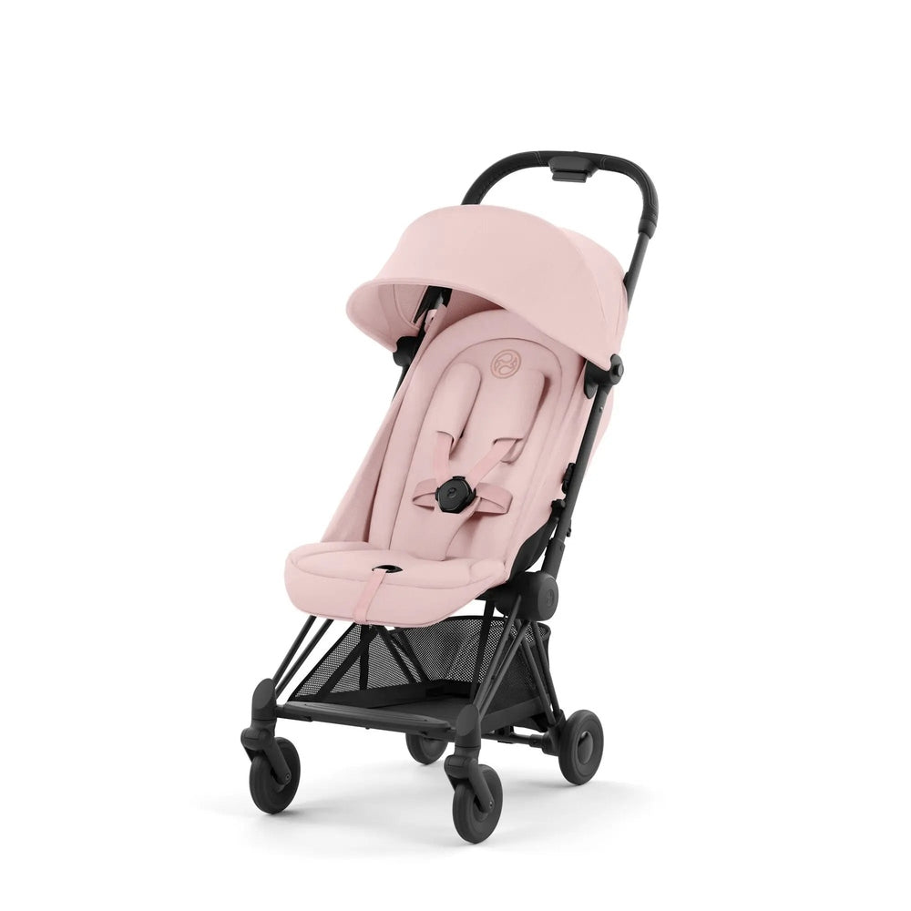 Cybex Coya Matt Black Frame Stroller in soft pink fabric with adjustable sun canopy and black frame.