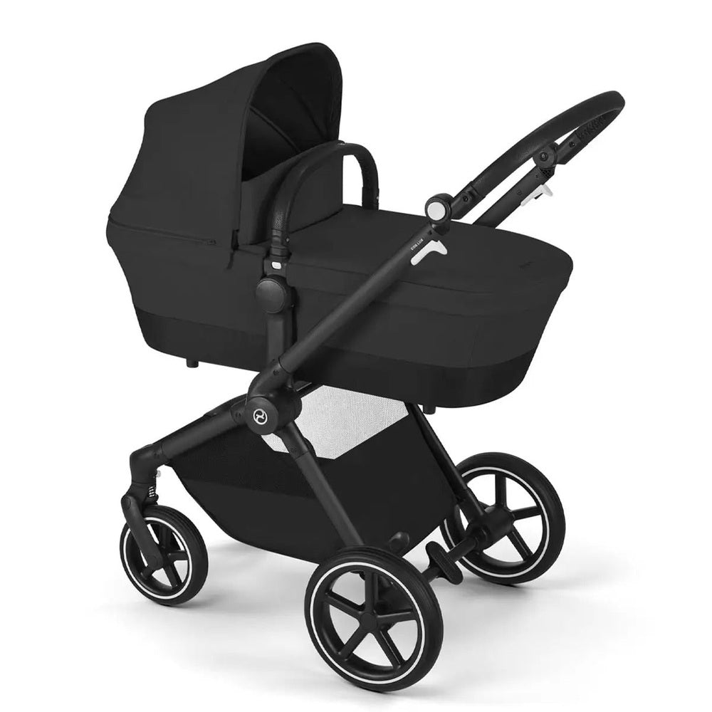 CYBEX EOS Lux 2-in-1 Stroller in black with bassinet attached and extended canopy, ready for city strolls.