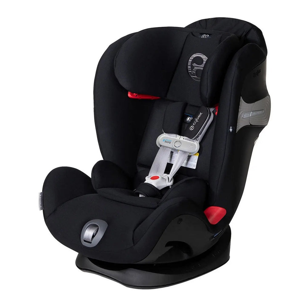 CYBEX Eternis S Sensorsafe convertible car seat in black fabric, showing padded headrest and 5-point harness secured.