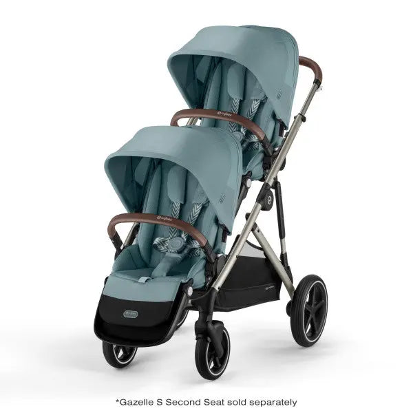 CYBEX Gazelle S V2 Stroller, teal twin-seat with extended canopies and brown faux-leather handles.