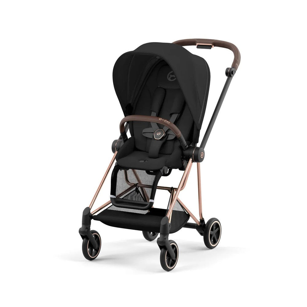 CYBEX Mios 3 stroller in black with rose-gold frame and brown leather accents, shown ready for city stroll.