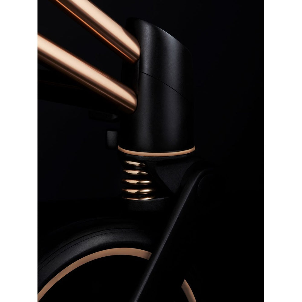 Cybex Priam 4 stroller in rose gold accents with sepia black frame, close-up of hinge and suspension.