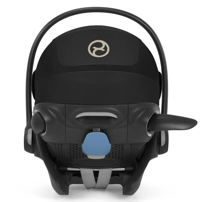 CYBEX Priam 4 Stroller with Lux Carry Cot Sepia Black, rear view showing integrated handle and blue adjustment knob.
