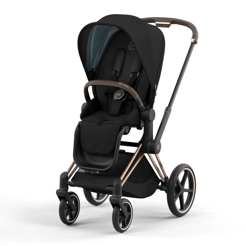 CYBEX Priam 4 Stroller Rose Gold/Sepia Black with Lux Carry Cot, canopy extended and seat secured.