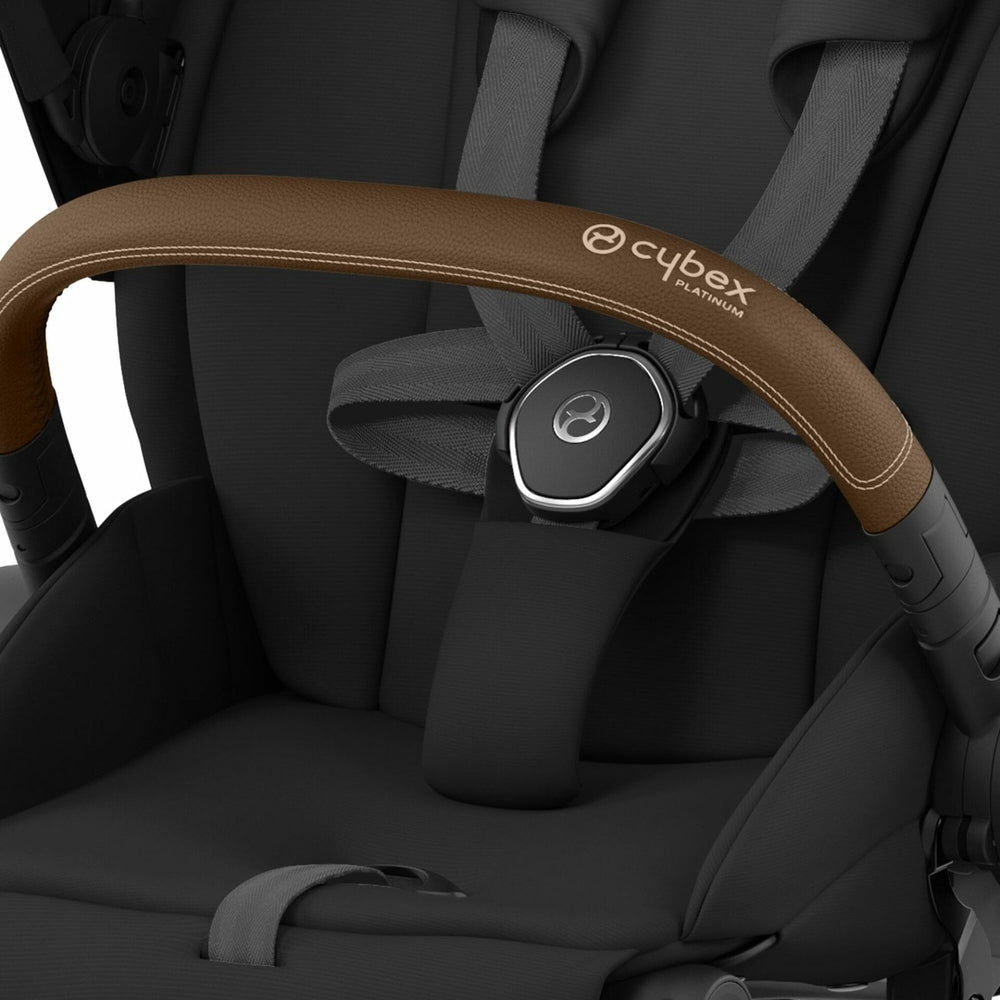 Cybex Priam 4 Stroller Rose Gold/Sepia Black with brown leather bumper bar and secure harness.