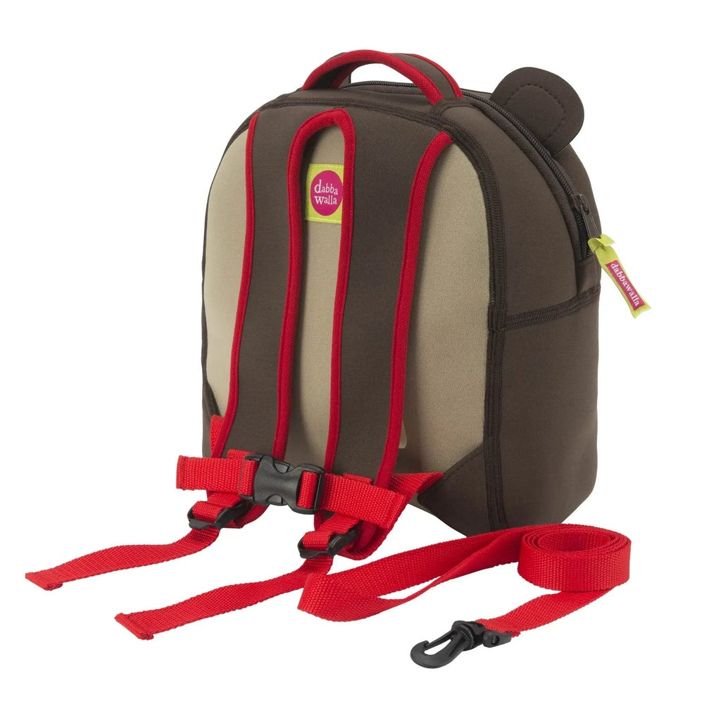 Dabbawalla Harness Backpack in brown with red trim; child harness leash attached and ready for use.