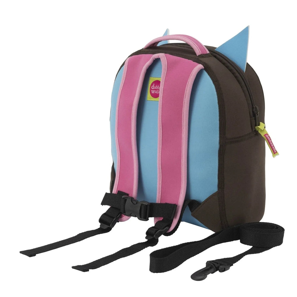 Dabbawalla Harness Backpack in blue with pink straps and brown sides, showing the clip-on leash and chest buckles.