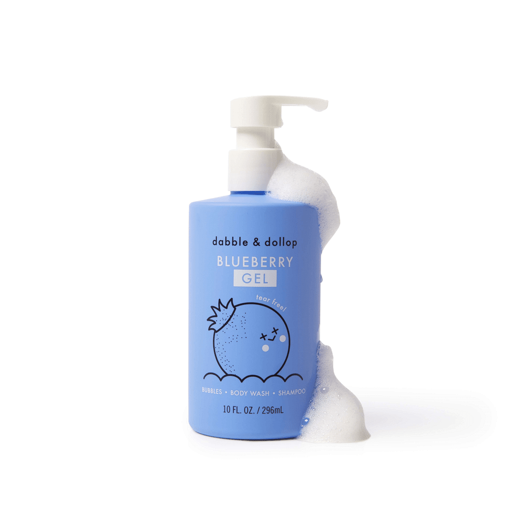 Dabble & Dollop All-Natural Shampoo, Body Wash & Bubbles Blueberry in a blue pump bottle dispensing foam.