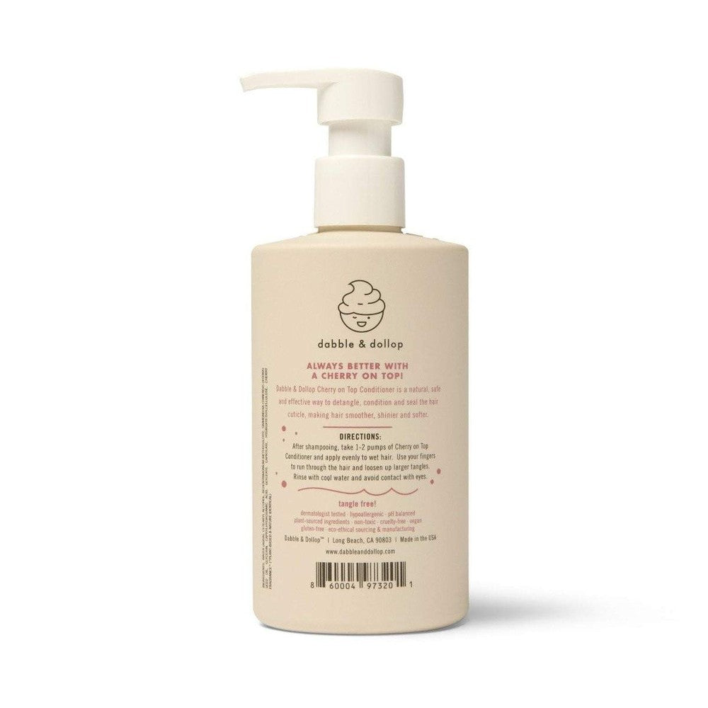 Dabble & Dollop Cherry on Top Hair Conditioner bottle with pump, beige hue and brand logo visible.