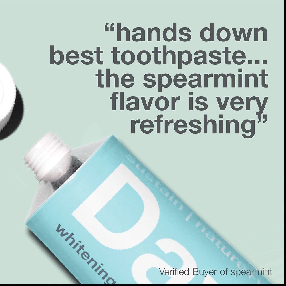 Davids Toothpaste Fluoride Free Spearmint, blue tube being squeezed to release minty toothpaste for a refreshing clean.