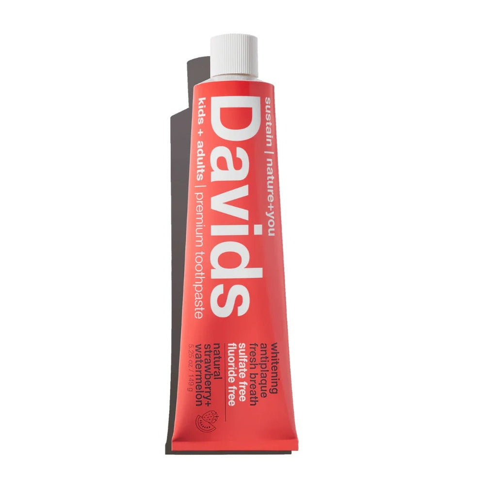 Davids Toothpaste Fluoride Free Strawberry Watermelon, red tube with white cap, standing upright.