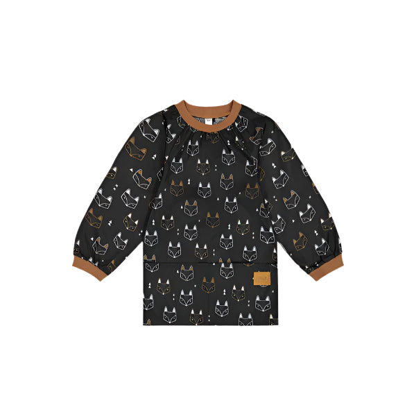 Deux Par Deux School Apron for kids, black fox-print fabric with brown cuffs and collar.