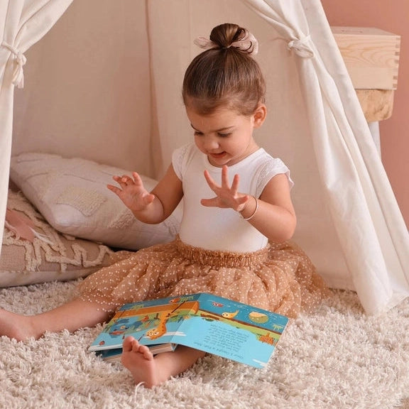 DITTY BIRD Sound Book Animal Songs USB-C Rechargeable; toddler reads colorful animal pages inside a cozy teepee.