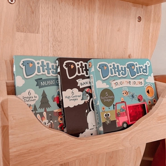 Ditty Bird Sound Book Black and White Animals USB-C Rechargeable; three Ditty Bird educational books on a wooden shelf.