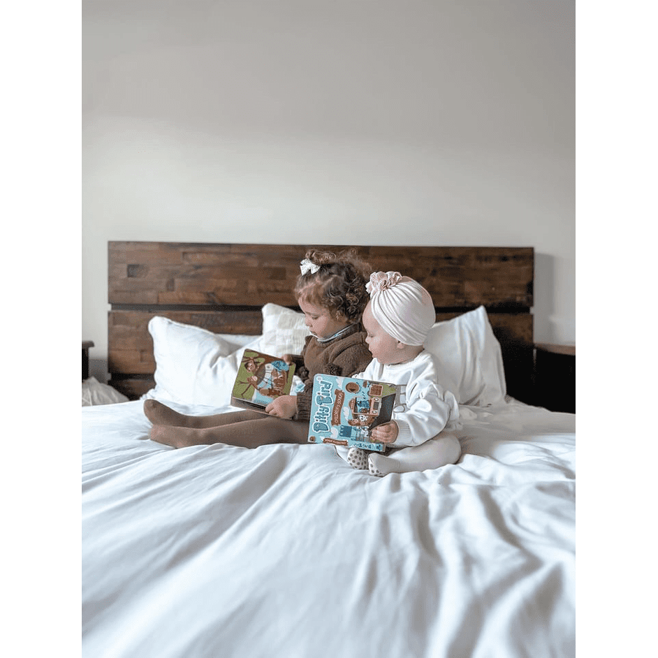 Ditty Bird Sound Book Children's Songs USB-C Rechargeable, two kids sit on a bed reading the educational toy.