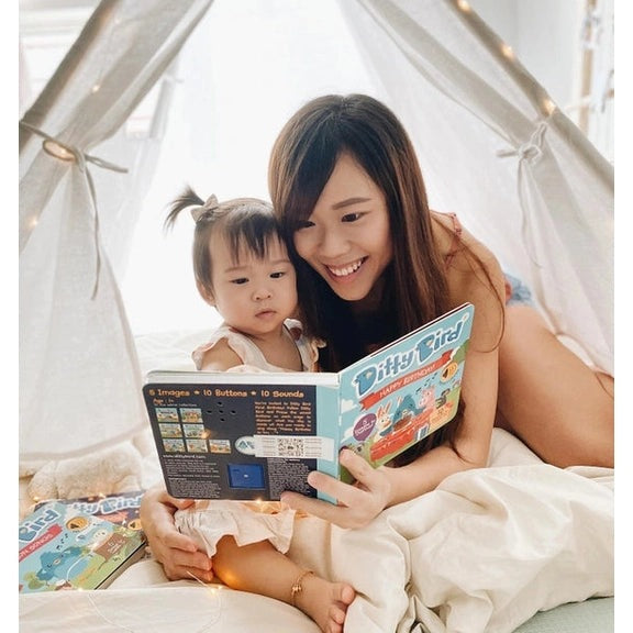 Ditty Bird Sound Book Happy Birthday USB-C Rechargeable read by a mom and toddler inside a cozy tent.