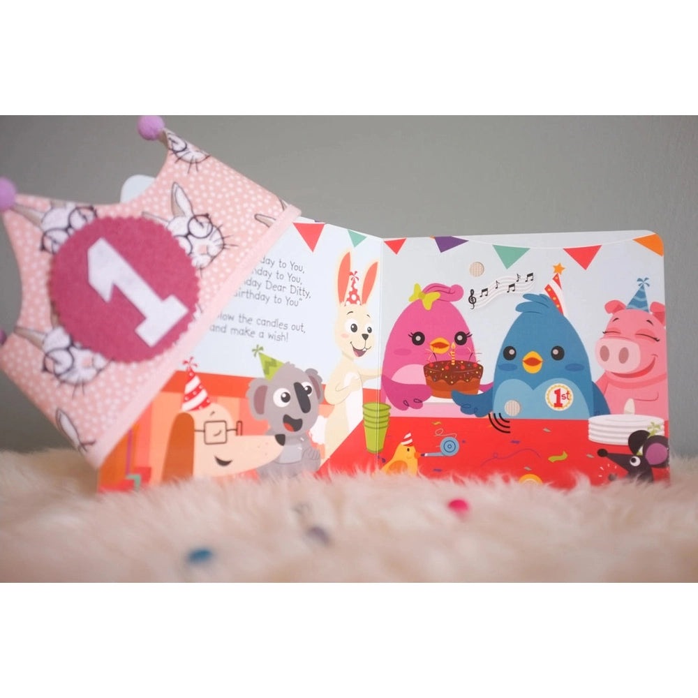 Ditty Bird Happy Birthday USB-C Rechargeable sound book opened to a bright birthday party with colorful birds.
