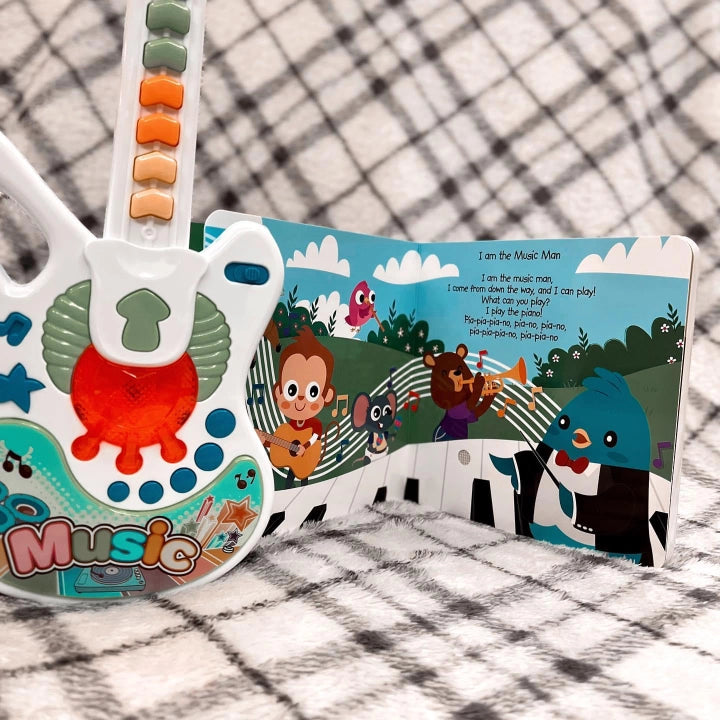 Ditty Bird Sound Book When I Grow Up Career Songs USB-C Rechargeable: colorful musical toy with bead keyboard beside an illustrated storybook.