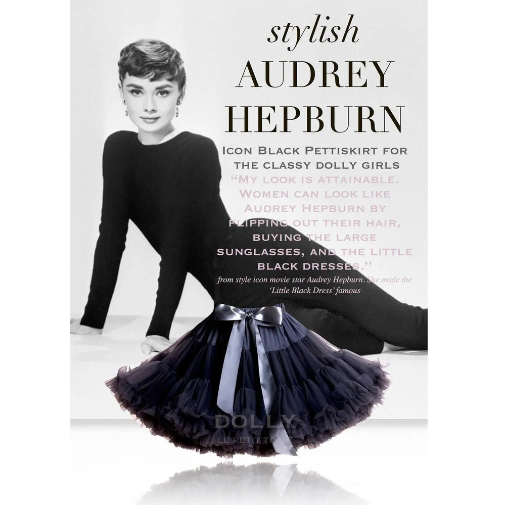 DOLLY BY LE PETIT TOM Pettiskirt Cat Princess Black with navy tulle layers and satin ribbon bow, laid on a reflective surface.