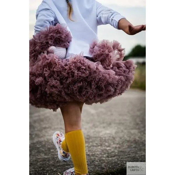 Dolly By Le Petit Tom Pettiskirt Thumbelina Mauve: toddler twirling fluffy mauve tulle skirt with yellow socks.