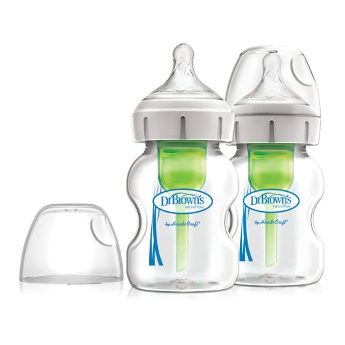 Dr. Brown's 5 oz wide-neck glass baby bottles, two-pack, clear glass with green inserts and white caps; cap sits nearby.