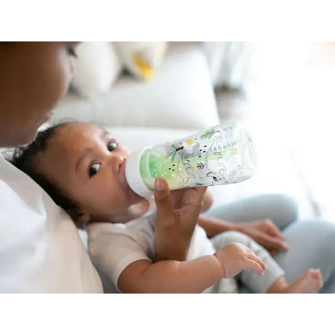 Dr. Brown's Wide-Neck Anti-Colic Options Bottle 9 oz/270 ml, 2-pack, as a parent feeds baby with the bottle.