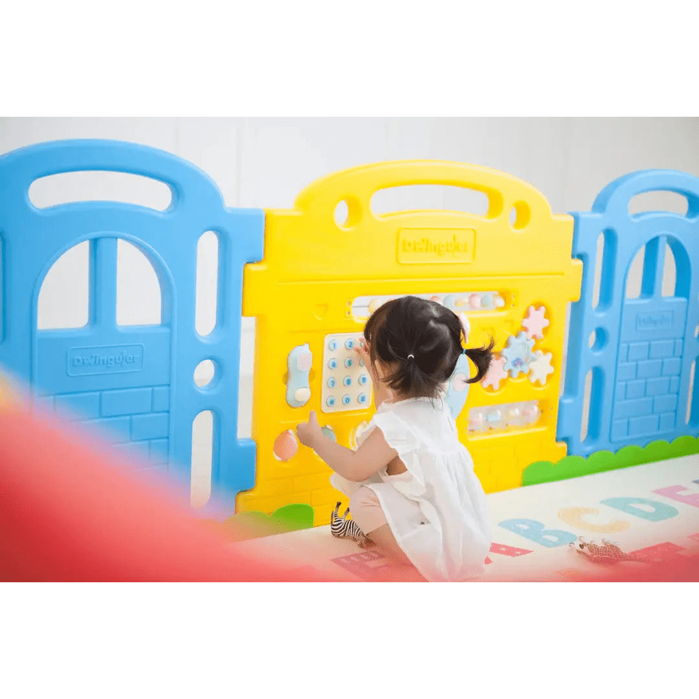 Dwinguler Castle Play Room Set blue and yellow fence panels; toddler interacts with the activity wall.