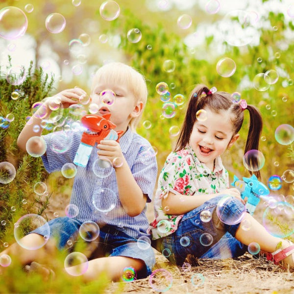 Eagle Stone shark bubble guns 2-set in red and blue; kids playing outdoors with bubbles