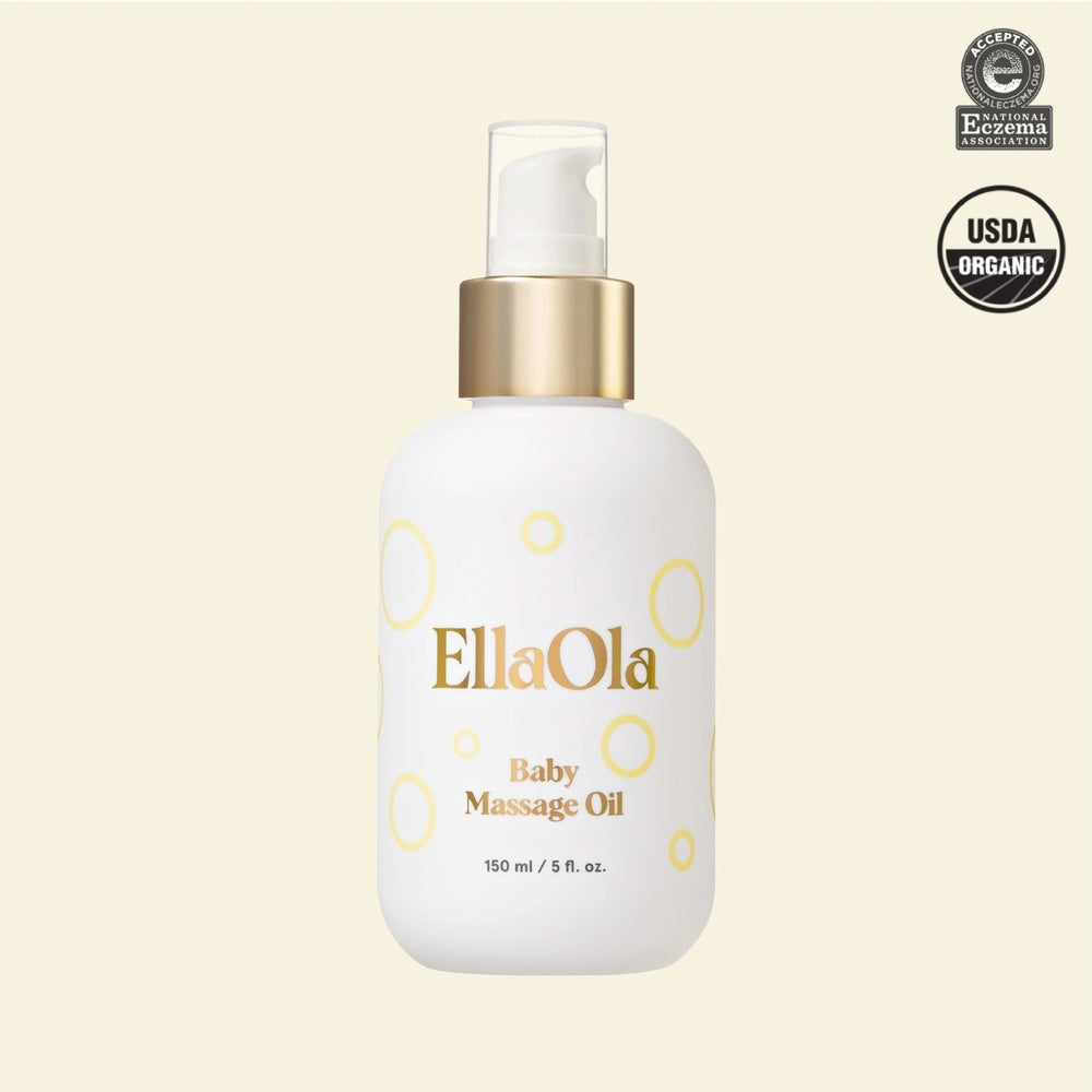 EllaOla Fragrance Free 100% USDA Organic Baby Massage Oil bottle with gold pump dispensing oil.