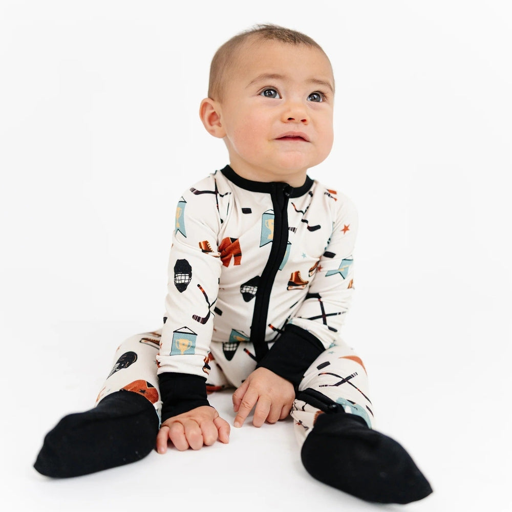 Emerson And Friends Hat Trick Hockey Bamboo Convertible Footie Romper in Beige and Multi with black cuffs and feet