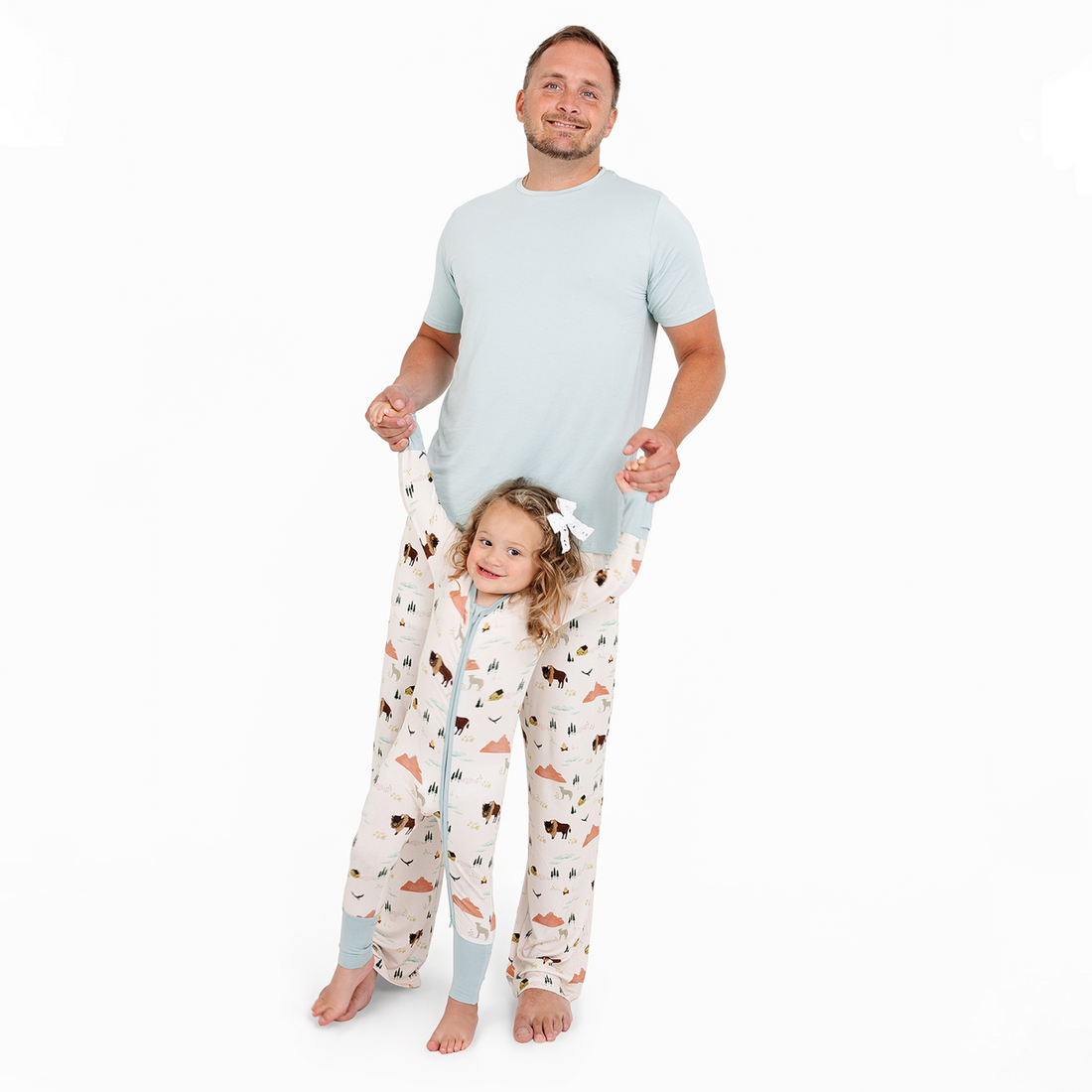 Parent and child wearing matching On The Ranch bamboo pajamas in Beige/Multi