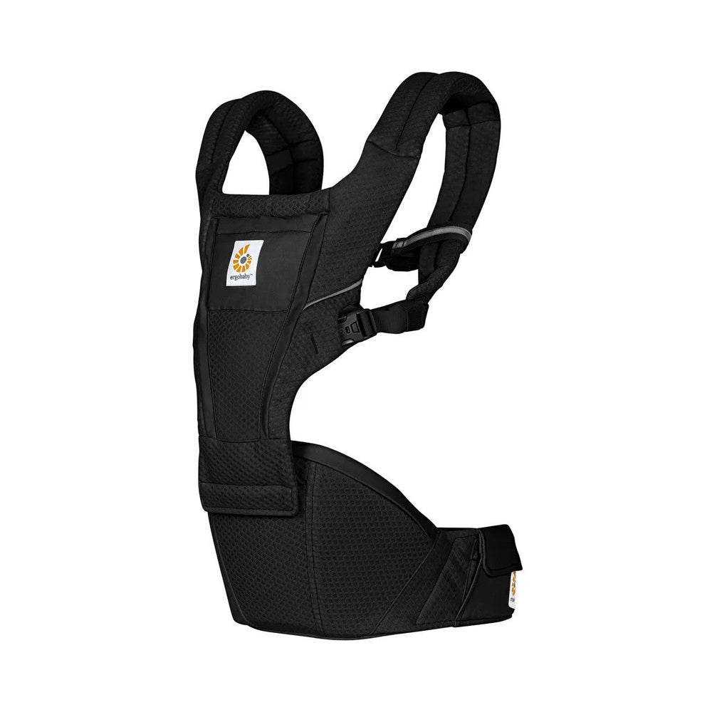 Ergobaby Alta Hip Seat Baby Carrier in black, with padded shoulder straps and waist belt in use on a parent.