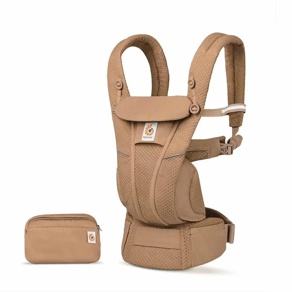 Ergobaby Omni Breeze baby carrier in tan with mesh panels and padded waist belt, shown with a matching pouch.