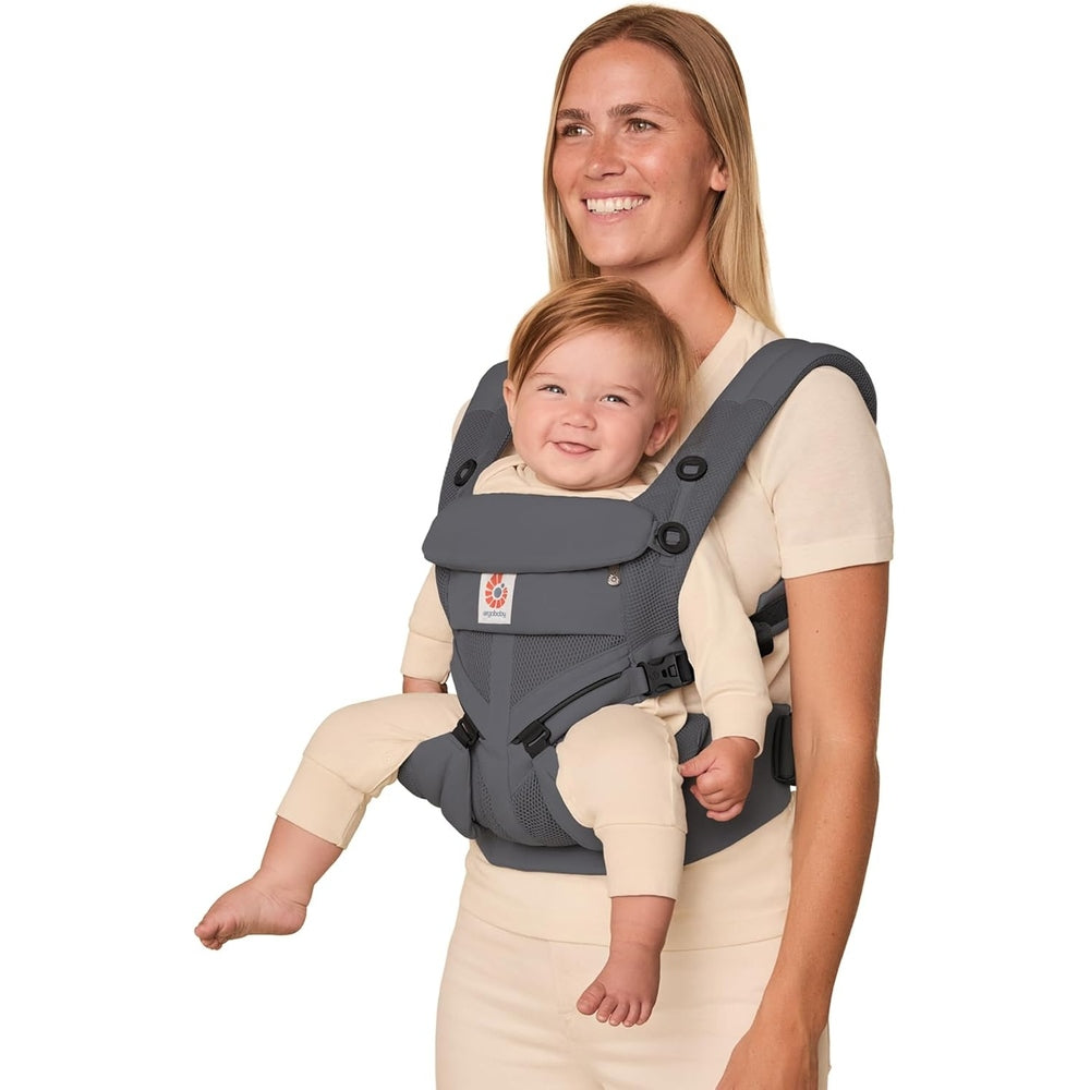 Ergobaby Omni Classic Mesh Baby Carrier Charcoal Grey worn by smiling mom with baby seated front.
