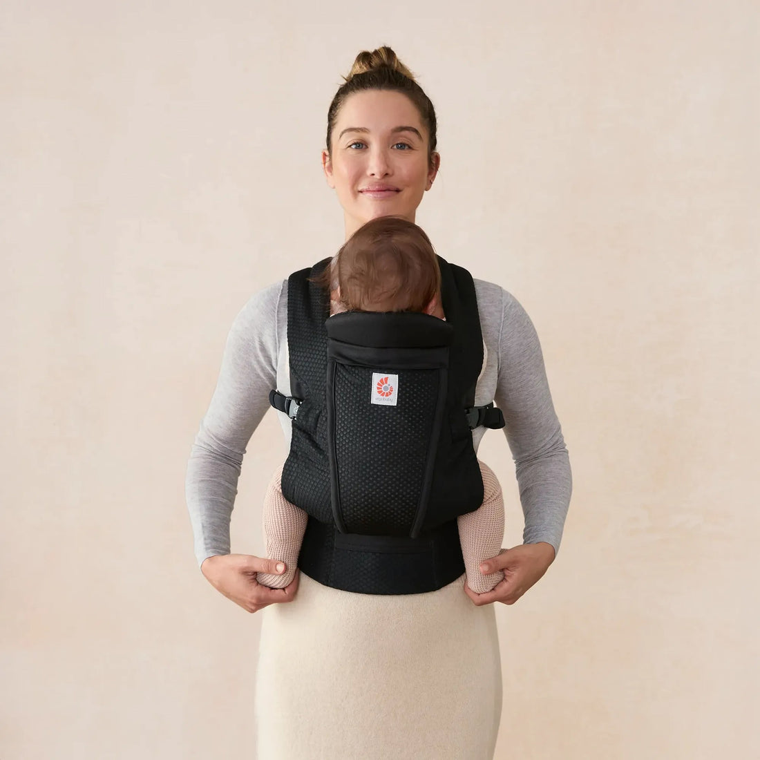Ergobaby Omni Lite Baby Carrier in Onyx Black, front view worn with baby