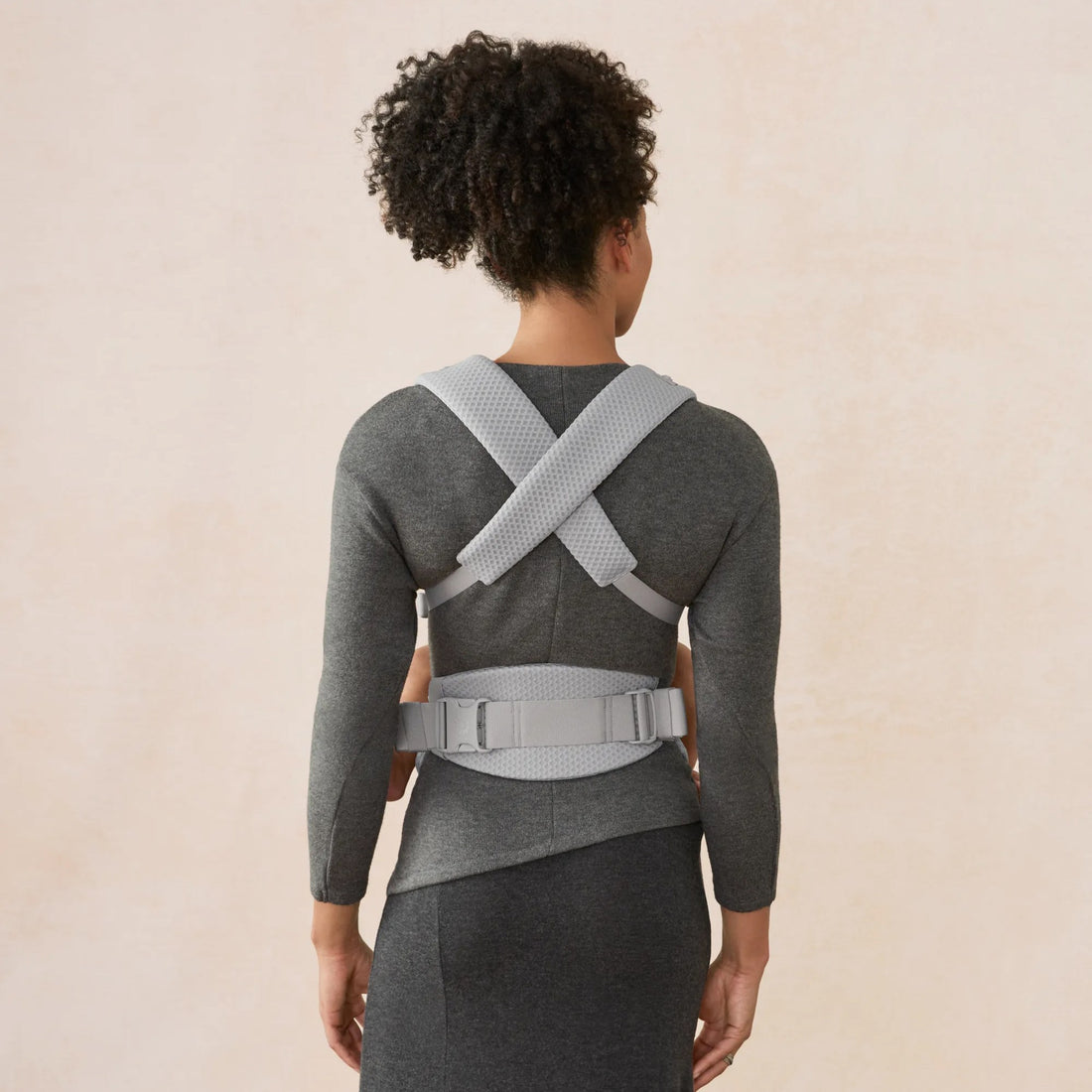 Ergobaby Omni Lite Baby Carrier in Pearl Grey, back strap view worn with baby