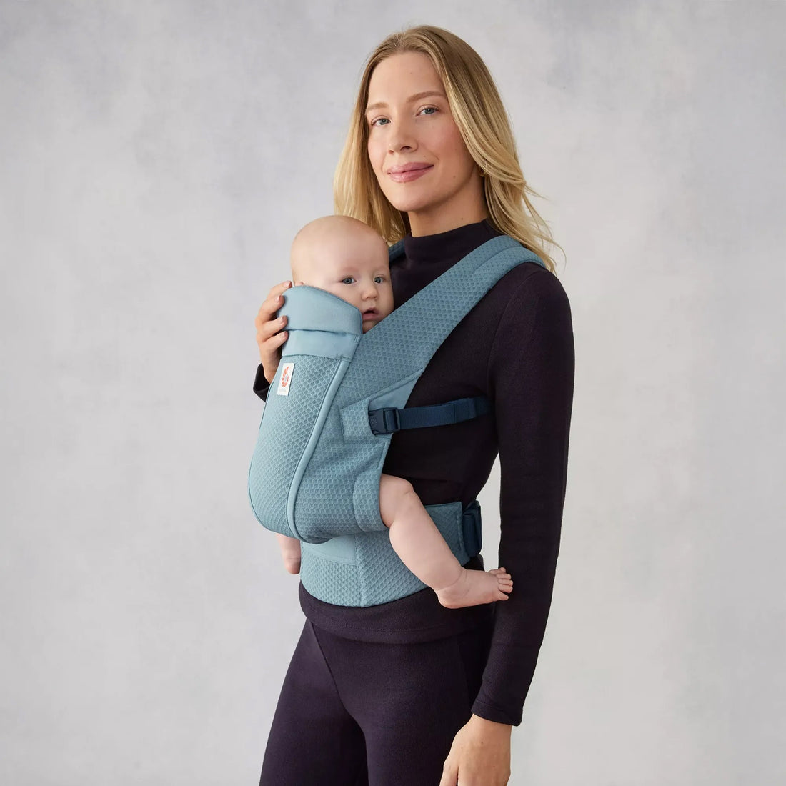 Ergobaby Omni Lite Baby Carrier in Slate Blue, side view worn with baby