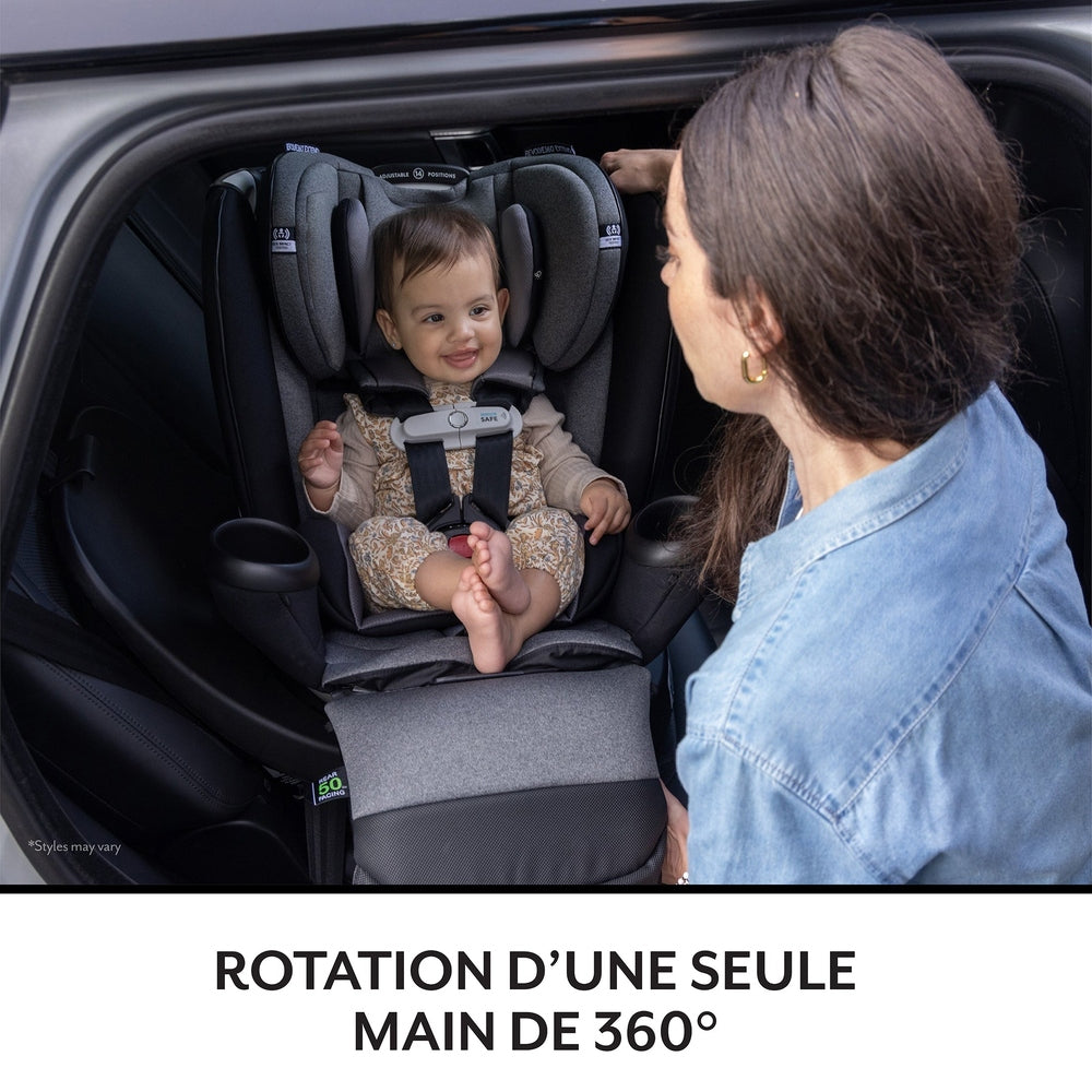 Evenflo Gold Revolve360 Extend All-In-One Rotational Car Seat With Sensorsafe; smiling baby buckled in harness in car.