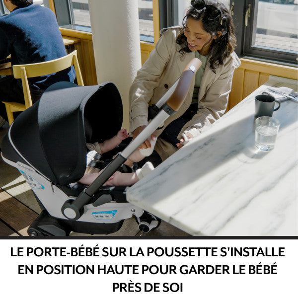 Evenflo Gold Shyft Dualride infant car seat and stroller combo with Carryall storage in gray/black.