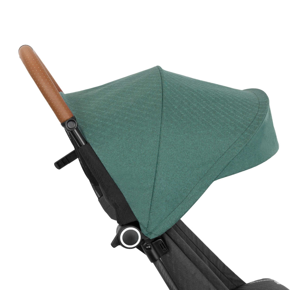 Evenflo Hummingbird ultralight carbon fiber stroller with green canopy and brown handle.