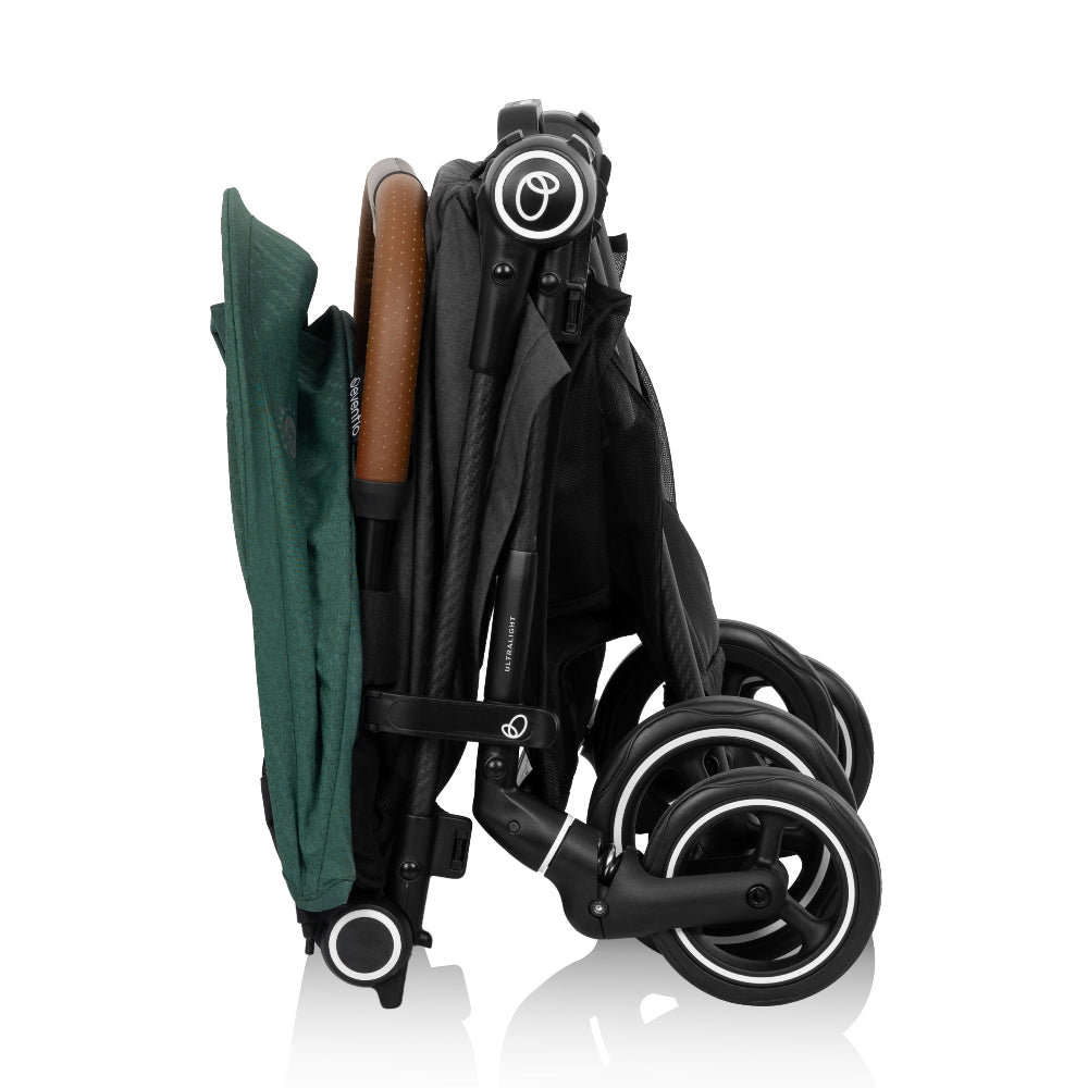 Evenflo Hummingbird Ultra-Lightweight stroller folded with green canopy and carbon-fiber frame