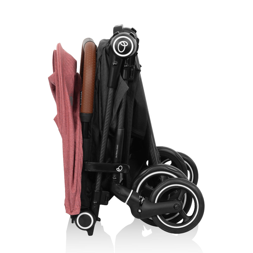 Evenflo Hummingbird ultralight stroller in carbon fiber with red seat fabric, folded.