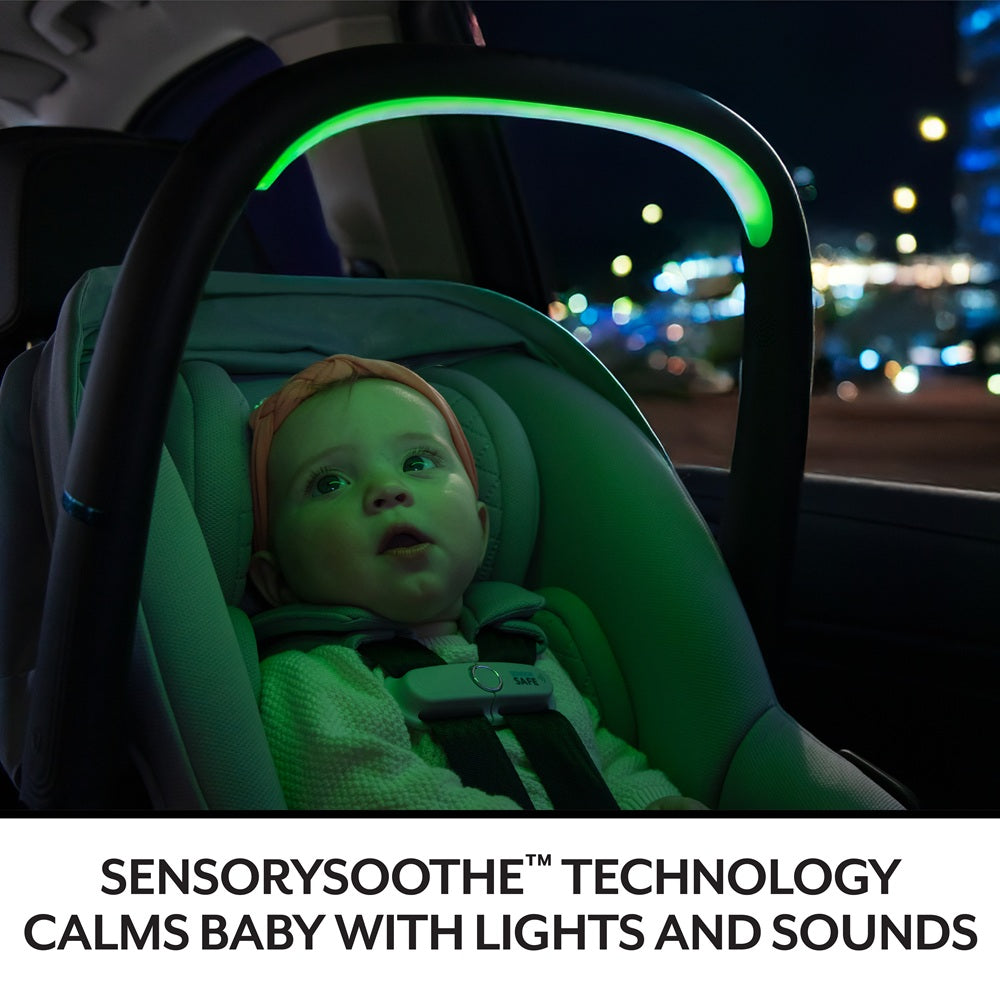 Evenflo Revolve180 Litemax NXT infant car seat with Sensorysoothe; baby in seat under green ambient lighting